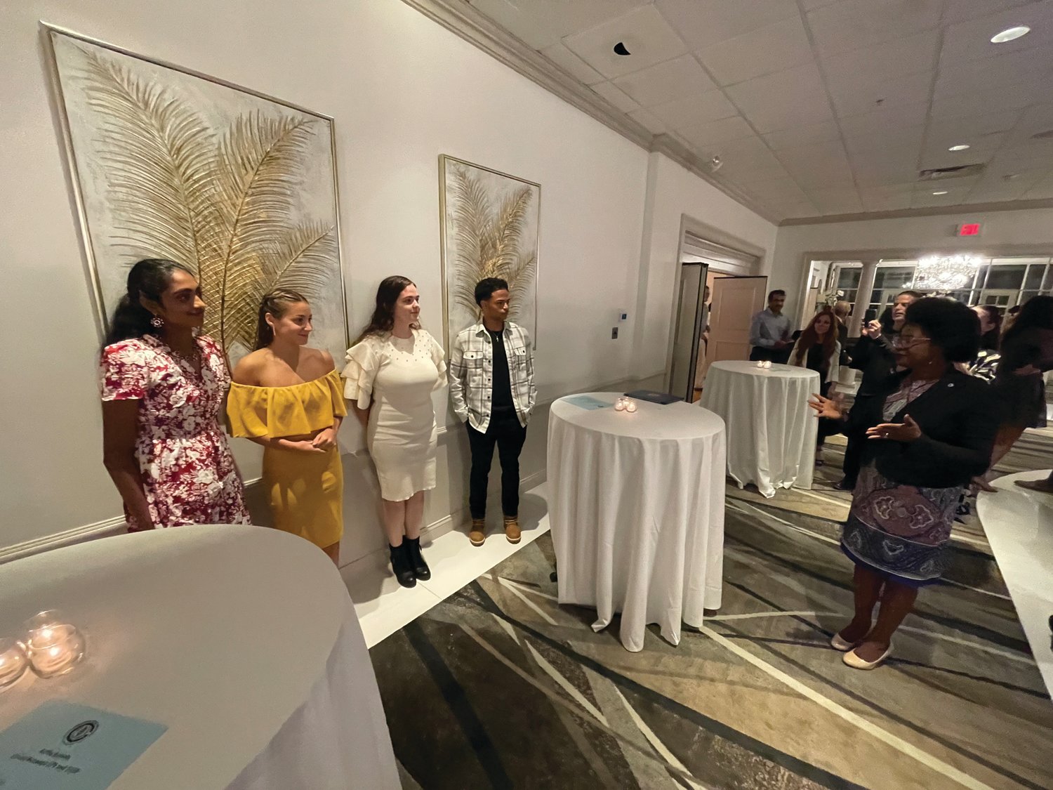 CONGRATULATIONS: Ward 2 City Councilwoman Aniece Germain, right, congratulates the four Hall of Fame scholarship recipients during an intermission at last week’s dinner. The scholars are, from left, Sanjana Ananthula, Mikaya Parente, Maria Silva and Xavier Pichardo.